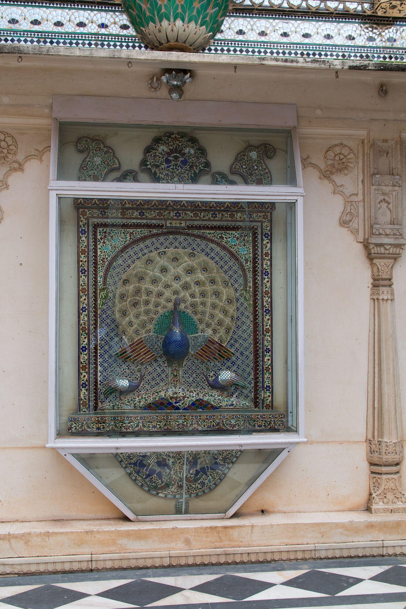 A peacock in coloured glass inlay set into a wall of Mor Chowk, the Peacock Courtyard of the City Palace.