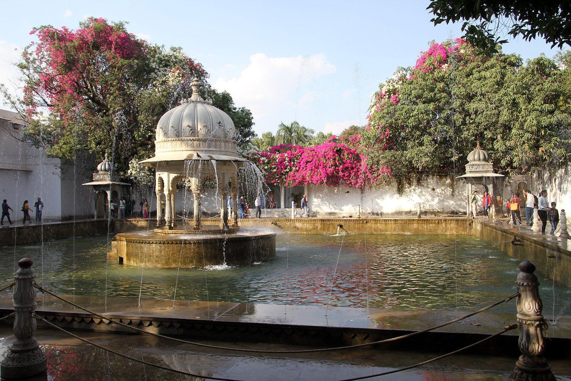 A fountain pavilion in the gardens of Saheliyon-ki-Bari, with pink bougainvillea in bloom.