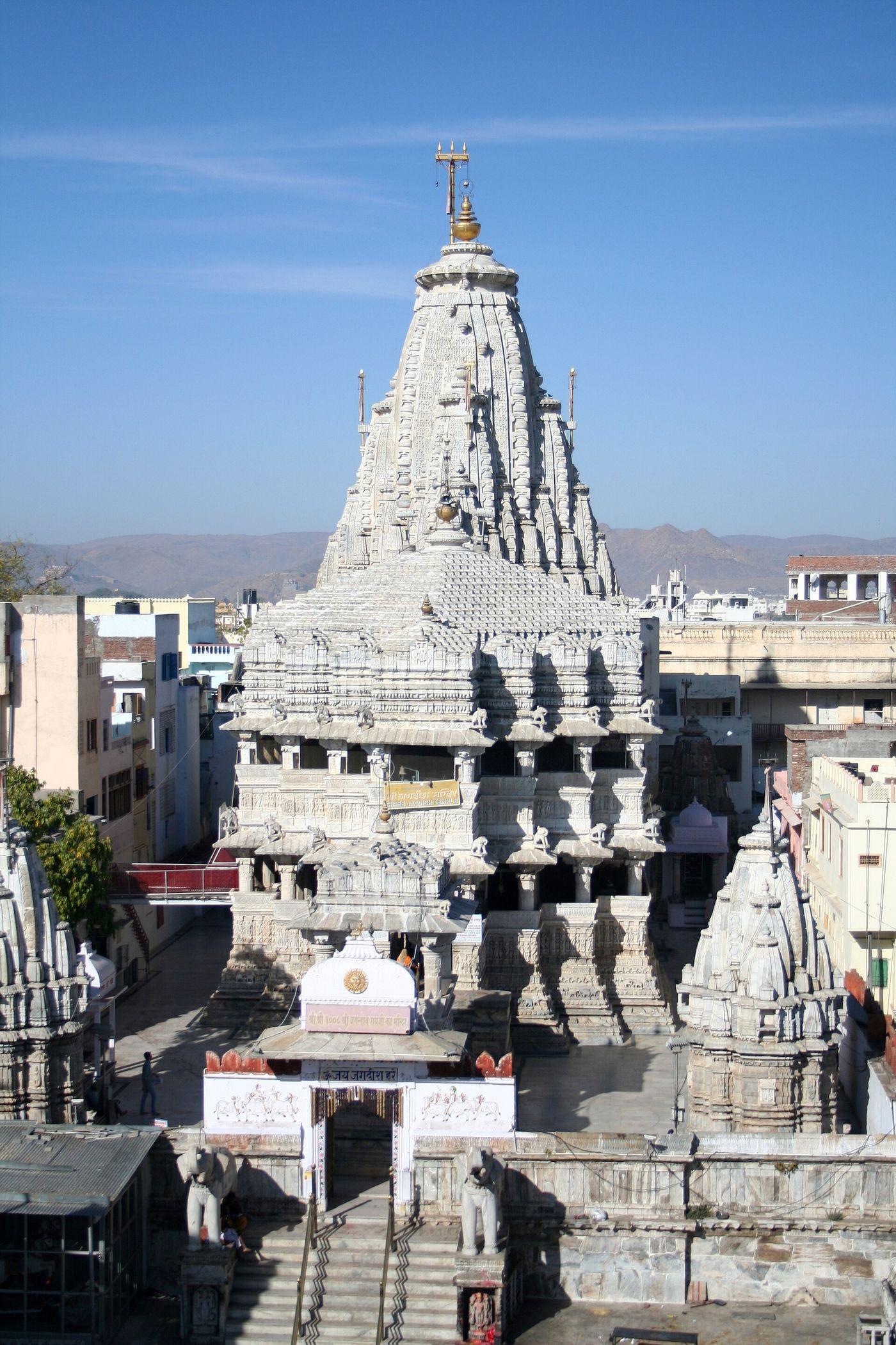 The white spire of Jagdish Temple in Udaipur's old city, with its entrance steps below.